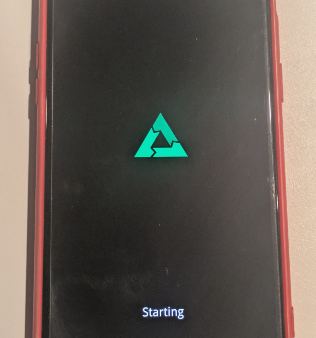 postmarketOS logo on a phone boot screen